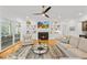 Inviting living room with a fireplace and a large sectional sofa, offering a comfortable and stylish space for relaxation at 2223 Winston Cir, Apex, NC 27502