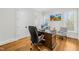 Bright office space with hardwood floors, large desk, and plenty of natural light at 2223 Winston Cir, Apex, NC 27502
