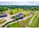 Scenic aerial view of Riverwood Golf Course, with the clubhouse and cart storage area at 240 Swann Trl, Clayton, NC 27527