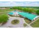 Aerial view of a green-roofed athletic complex, showcasing recreational amenities and landscaping at 240 Swann Trl, Clayton, NC 27527