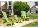 Cozy backyard features a patio with green Adirondack chairs and outdoor seating area at 240 Swann Trl, Clayton, NC 27527