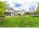 Expansive backyard featuring a patio, outdoor seating area, and a trampoline for recreation at 240 Swann Trl, Clayton, NC 27527
