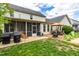 Spacious backyard features patio with a grill, a screened-in porch and an outdoor seating area at 240 Swann Trl, Clayton, NC 27527