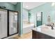 Bright bathroom with a garden tub, glass shower and stylish fixtures at 240 Swann Trl, Clayton, NC 27527