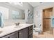 Bathroom features a vanity with marble countertop, tile floors, and shower with tile surround at 240 Swann Trl, Clayton, NC 27527