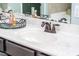 Elegant bathroom vanity with a marble countertop and stylish fixtures at 240 Swann Trl, Clayton, NC 27527