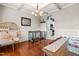 Charming dining room with unique hanging chair, complemented by hardwood floors and natural light at 240 Swann Trl, Clayton, NC 27527