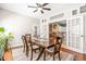 Open-concept dining room with stylish table and chairs, flowing into other living areas at 240 Swann Trl, Clayton, NC 27527