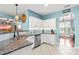 Modern kitchen with stainless appliances, granite countertops, and white cabinetry at 240 Swann Trl, Clayton, NC 27527