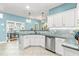 Well-lit kitchen features stainless appliances and granite countertops at 240 Swann Trl, Clayton, NC 27527