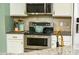 Well-equipped kitchen features stainless steel appliances, granite countertops, and stylish cabinetry at 240 Swann Trl, Clayton, NC 27527