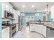 Contemporary kitchen with stainless steel appliances, granite counters, and white cabinets at 240 Swann Trl, Clayton, NC 27527