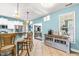 Kitchen bar with stylish stools, stainless appliances, and bright, airy design at 240 Swann Trl, Clayton, NC 27527