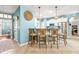 Open kitchen bar with seating, stainless steel appliances, and modern lighting fixtures at 240 Swann Trl, Clayton, NC 27527