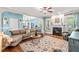 Cozy living room with a fireplace, plush seating, and an inviting, colorful rug at 240 Swann Trl, Clayton, NC 27527