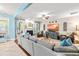 Spacious living room with a fireplace, large sectional sofa, and ample natural light at 240 Swann Trl, Clayton, NC 27527