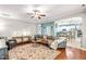 Spacious living area featuring a patterned rug, comfortable seating, and stylish furnishings at 240 Swann Trl, Clayton, NC 27527