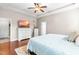 Well-lit bedroom with a decorative dresser and neutral decor at 240 Swann Trl, Clayton, NC 27527
