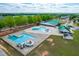 Aerial view of community pool with slides, zero entry wading area, and lap lanes at 240 Swann Trl, Clayton, NC 27527