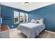Calming bedroom with a large bed, soothing blue walls, and ample natural light at 245 Naples Ln, Clayton, NC 27527