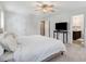 Bedroom featuring neutral walls and carpeted floor with a TV and walk-in closet at 245 Naples Ln, Clayton, NC 27527