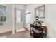 Bright entryway featuring a decorative mirror, hall tree, and wood-look flooring at 245 Naples Ln, Clayton, NC 27527