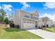 Two-story home featuring a large driveway and well-maintained lawn at 245 Naples Ln, Clayton, NC 27527