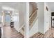 Hallway with stairs that leads into an open floor plan and has natural light at 245 Naples Ln, Clayton, NC 27527