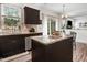 Kitchen island features granite countertops and stainless steel appliances at 245 Naples Ln, Clayton, NC 27527