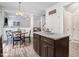 Open-concept kitchen with granite countertops and stainless steel appliances at 245 Naples Ln, Clayton, NC 27527