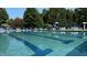 A stunning community pool with clear blue water and comfortable lounge chairs at 245 Naples Ln, Clayton, NC 27527