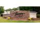 The Tuscany community entrance sign with stone detail at 245 Naples Ln, Clayton, NC 27527