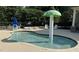 A fun splash pad with a mushroom water feature and lounge chairs at 245 Naples Ln, Clayton, NC 27527