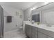 Bathroom with a double vanity sink, a toilet and decorative wall art at 25 S Treeline Dr, Spring Hope, NC 27882