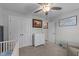Bedroom with a ceiling fan, a framed bible verse on the wall, and a crib partially visible at 25 S Treeline Dr, Spring Hope, NC 27882