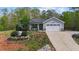 Charming single-story home with well-manicured lawn, landscaping, and attached two car garage at 25 S Treeline Dr, Spring Hope, NC 27882