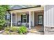 Inviting front porch with seating, decorative plants, and a charming entrance for a welcoming appeal at 25 S Treeline Dr, Spring Hope, NC 27882