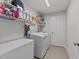 Laundry room with white washer, dryer and a deep freezer for storage at 25 S Treeline Dr, Spring Hope, NC 27882
