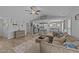 Open-concept living room with a sectional sofa, kitchen in the background, and stylish decor elements at 25 S Treeline Dr, Spring Hope, NC 27882
