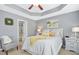 Comfortable bedroom featuring a stylish tray ceiling and soothing gray color palette at 2728 Cloud Mist Cir, Raleigh, NC 27614