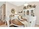Charming dining room with a decorative white cabinet and a wooden table at 2728 Cloud Mist Cir, Raleigh, NC 27614