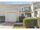 Charming townhome featuring a one car garage and well-maintained landscaping at 2728 Cloud Mist Cir, Raleigh, NC 27614