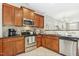 Well-equipped kitchen featuring stainless steel appliances and dark countertop at 2728 Cloud Mist Cir, Raleigh, NC 27614