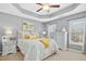 Serene main bedroom featuring gray walls and a tray ceiling at 2728 Cloud Mist Cir, Raleigh, NC 27614