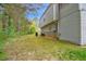 View of the backyard of this two-story home with wooded border at 2816 Delco Ct, Raleigh, NC 27610