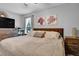 Comfortable bedroom showcasing a queen size bed, a nightstand, and a window with natural lighting at 2816 Delco Ct, Raleigh, NC 27610
