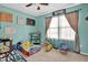 bedroom with bright, colorful decor, a daybed, and a sunny window at 2816 Delco Ct, Raleigh, NC 27610