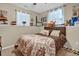 Bedroom with a decorative bed, a window with natural lighting, and wall decor at 2816 Delco Ct, Raleigh, NC 27610