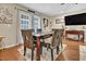 Elegant dining area with a large table, stylish chairs, and natural light at 2816 Delco Ct, Raleigh, NC 27610