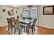 Inviting dining area with seating for six and a view into the kitchen at 2816 Delco Ct, Raleigh, NC 27610